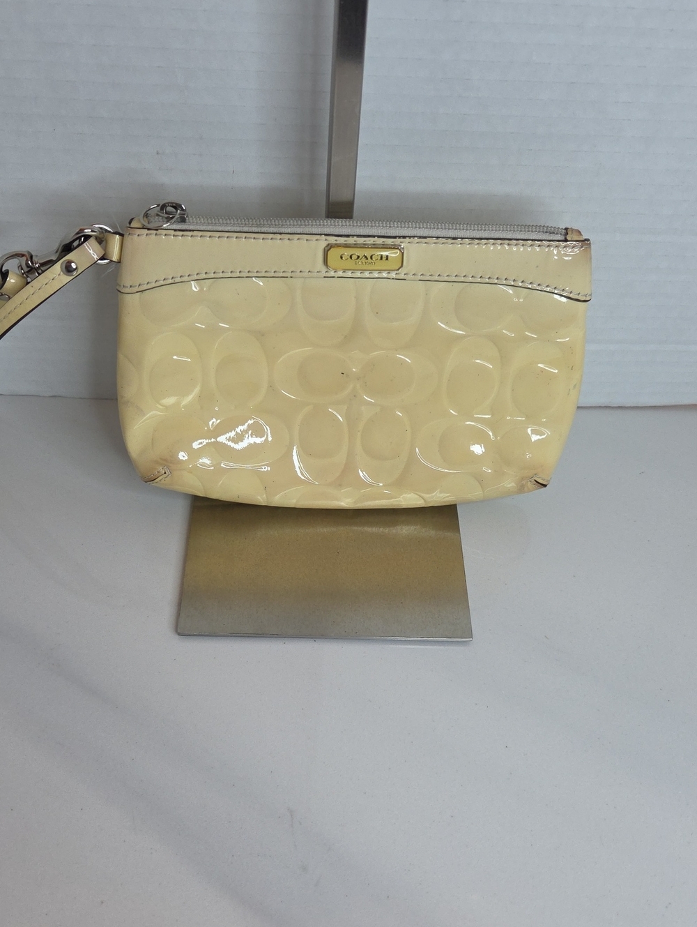 COACH Pale Yellow Patent Leather Wristlet with Signature Emboss